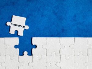 Puzzle piece labelled 'Insurance' fitting into place, symbolizing mental health financial assistance coverage.