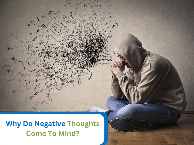 A person feeling overwhelmed, illustrating why negative thoughts creep in.