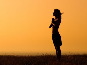 A woman practising breathing exercises to manage mindfulness emotions and promote emotional well-being.