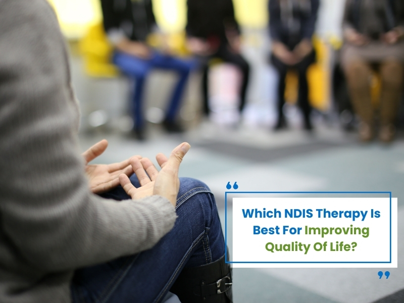 NDIS therapy: A person in a group therapy setting, discussing ways to improve their quality of life.