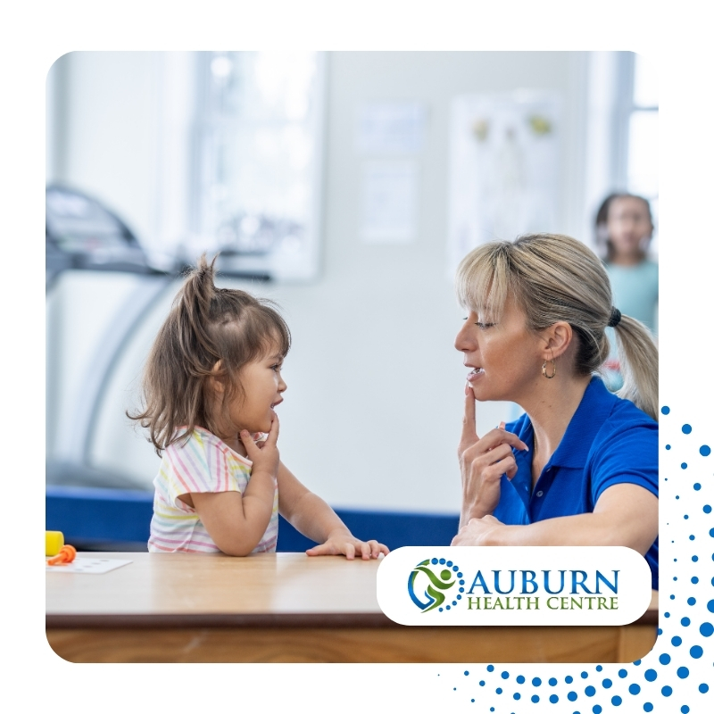 Speech therapy for toddlers session with a therapist and young girl practicing speech exercises at Auburn Health Centre.